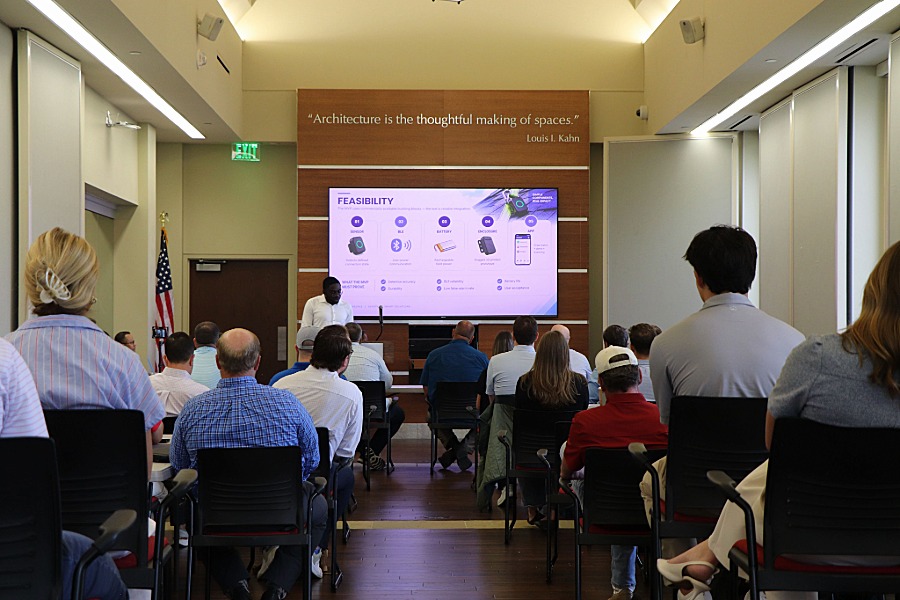 Group of people watching a presentation. 