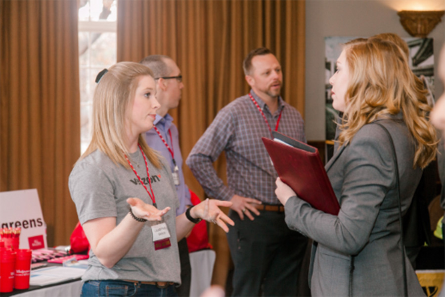 Two women discussing industry jobs