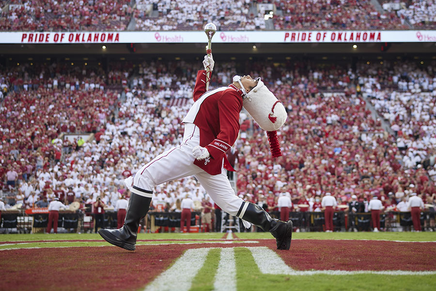 Drum major marching the field during pre-game at Gaylord Family Oklahoma Memorial Stadium.