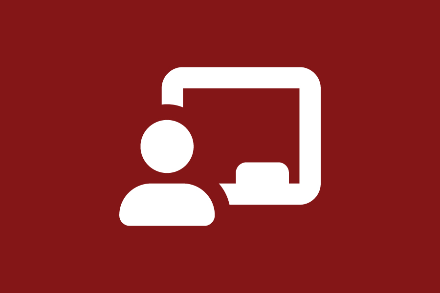 A white person in front of a chalkboard icon on a crimson background.