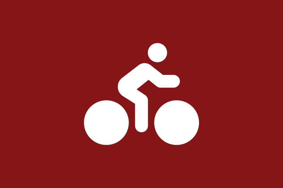 A white person on a bicycle icon on a crimson background.