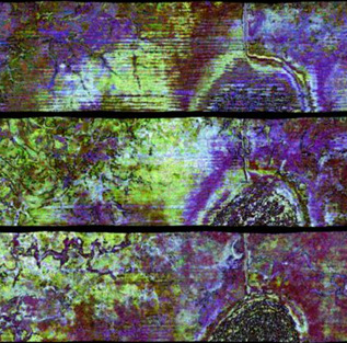 Researchers at AASPI annual meeting sitting around a table talking.