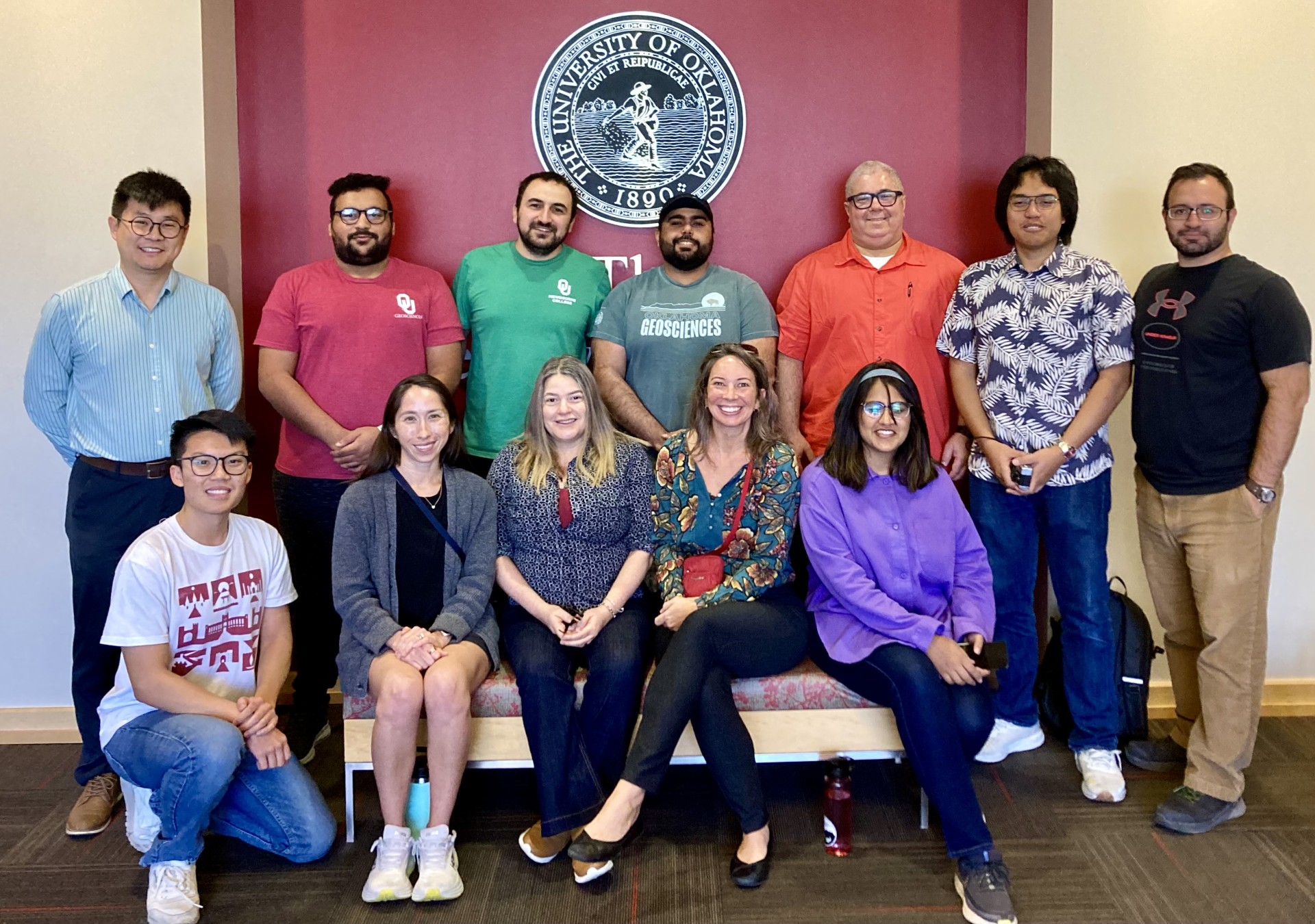 AASPI researchers standing in front of the OU seal.