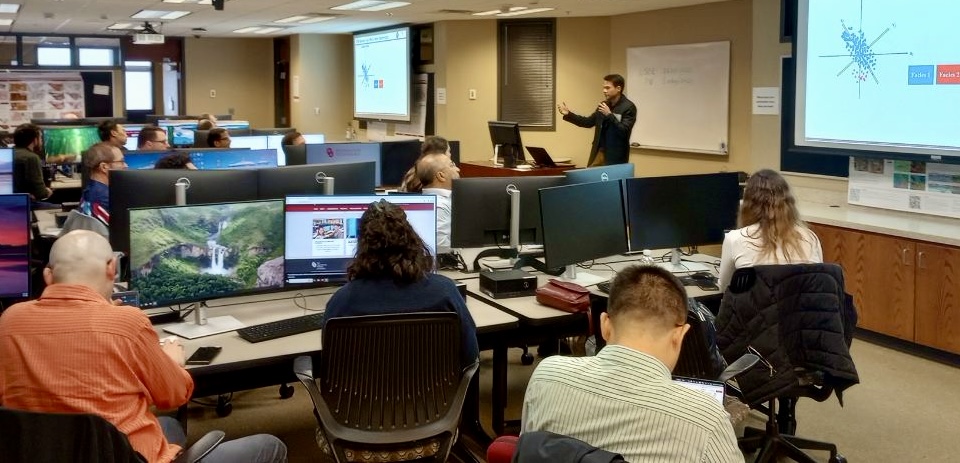 AASPI researchers sitting in a conference room.