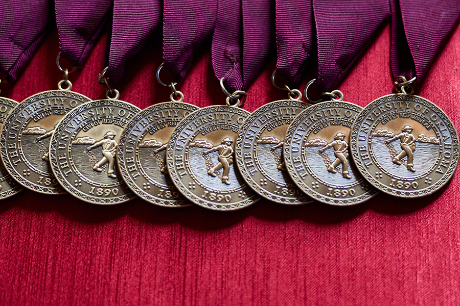 Photo of eight 4.0 medallions on a table.