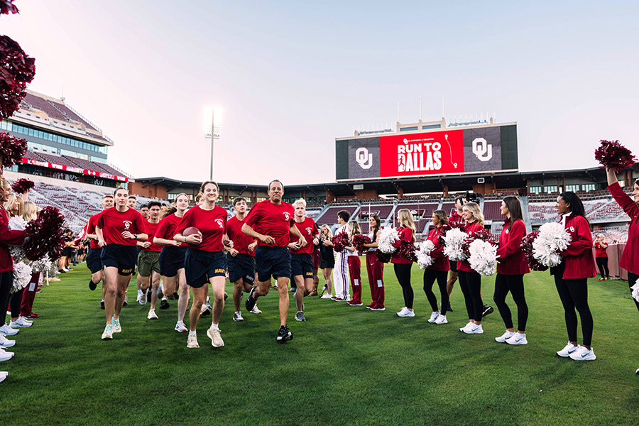 OU President Joseph Harroz Jr and NROTC members participate in the Run to Dallas.