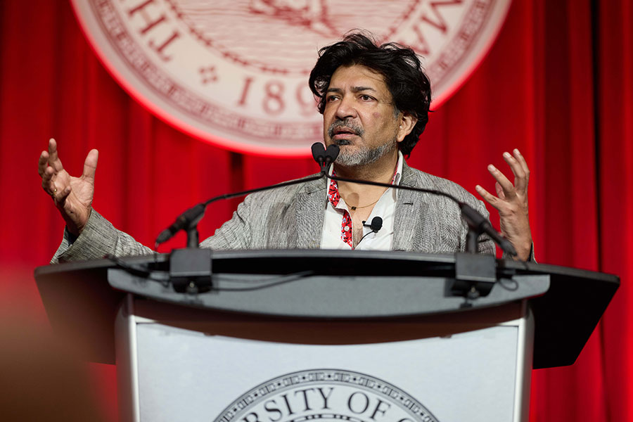 Siddhartha Mukherjee speaking at a podium.