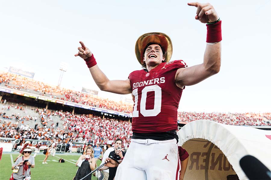 The Sooners celebrate a victory with a football playing riding the Schooner.