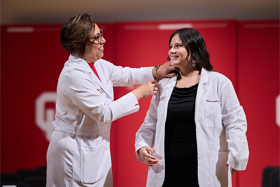 A person receiving their white coat during the College of Dentistry and College of Medicine White Coat Ceremonies.