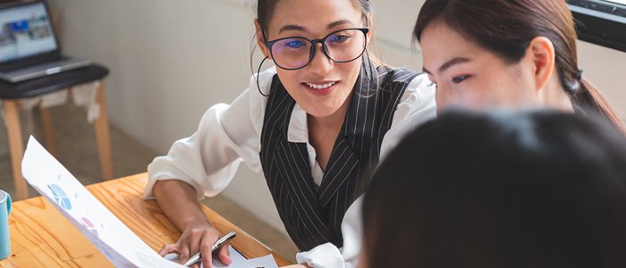 two coworkers discussing a project
