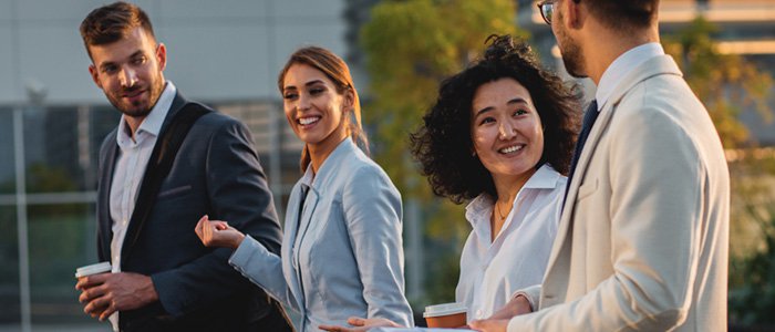 Group of 4 coworkers walking
