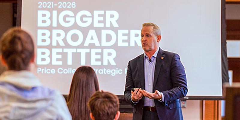 Dean Corey Phelps giving a presentation to a room of students