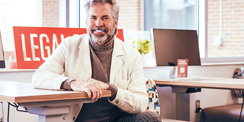 David Kinsinger sits at a desk in the Entrepreneurial Law Center