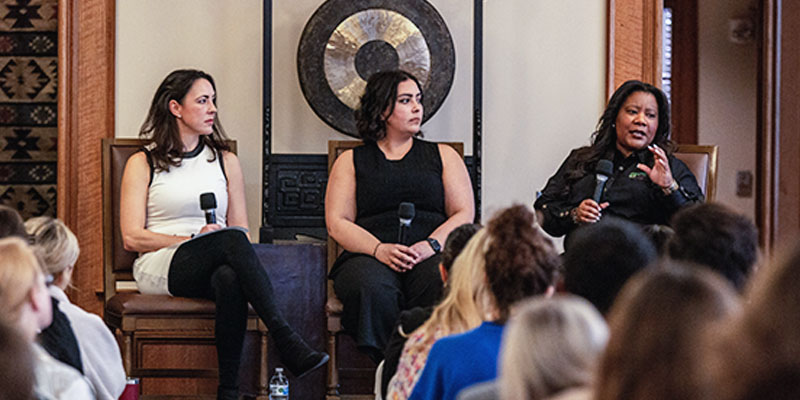 Professors and guest speakers interact with students during an question and answer session in Price Hall