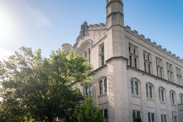 A building with a tree next to it.