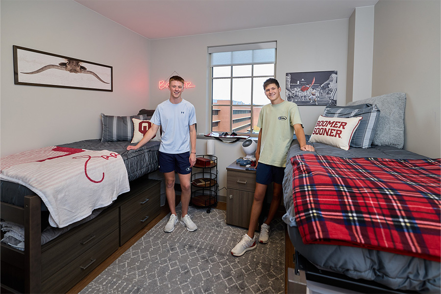 Two students in residential college room.