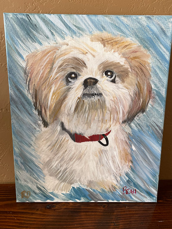 A painting showing a fluffy white and tan dog looking alert.