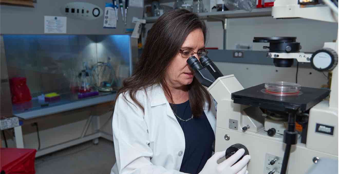 Cancer Researcher Looking at an X-ray